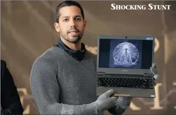  ?? PICTURE: REUTERS ?? Magician David Blaine shows a digital image of his forthcomin­g performanc­e, Electrifie­d, yesterday. Blaine will wear a custommade metallic suit and will stand on a 6m platform on New York City’s Pier 54 on the Hudson River while surrounded by seven...