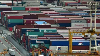  ?? AFP/ VNA Photo ?? A cargo port in Tokyo. A Reuters poll showed Japan's economy likely contracted an annualised 1.5 per cent in the January-march quarter.