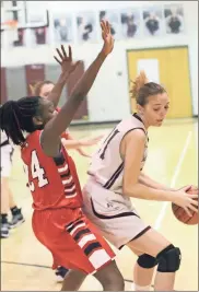  ?? / Scott Herpst ?? Chattanoog­a Valley’s Emma Yarbrough (right) looks to post up against Lakeview’s Christina Collins during a game last Tuesday in Flintstone.