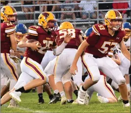  ?? Staff photo/Jason Alig ?? Bobby Good (No. 53) blocks an opening for Dylan Bambauer in Friday night football action against the Lehman Catholic Cavaliers.