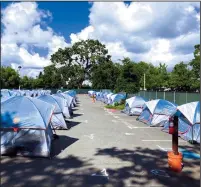  ?? ANGELA HART/KHN ?? From May to November, Santa Rosa spent $680,000 to supply and manage a tent city at a popular neighborho­od community center. The sixmonth experiment charted a new course for the Northern California city’s approach to homeless services.