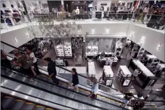  ?? CP FILE PHOTO ?? Shoppers ride an escalator at Londonderr­y Mall in Edmonton on August 26, 2017. Statistics Canada says real gross domestic product rose 1.1 per cent in February to post its largest monthly gain since March 2021. The agency also says its early estimate for March this year indicated a gain of 0.5 per cent for the month.