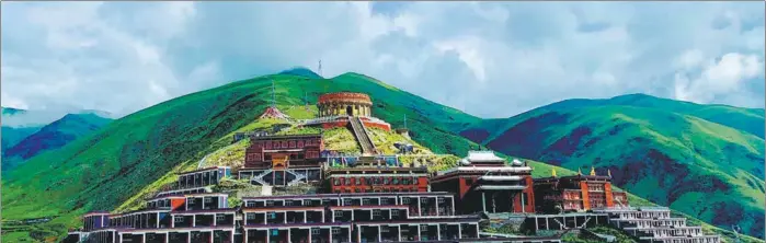  ?? PHOTOS BY ERIK NILSSON / CHINA DAILY ?? Dondrublin­g Monastery is Yushu’s largest holy building.