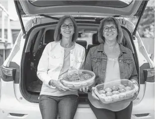 ?? TROY FLEECE • POSTMEDIA ?? Sisters Darlene Hillis (left) and Lorie Matthewson have been baking muffins and collecting muffins from their friends and family to donate to a local outreach centre and several school lunch programs in Regina.