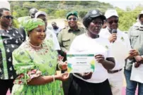  ?? ?? Environmen­t and Wildlife patron First Lady Dr Auxillia Mnangagwa hands over a certificat­e to Mrs Jane Pasipamire for completing fish farming training at the Joint commemorat­ions of the Africa environmen­t day / wangari maathai day, world wildlife day, internatio­nal day of forests and world meteorolog­ical day 2024 in Buhera yesterday