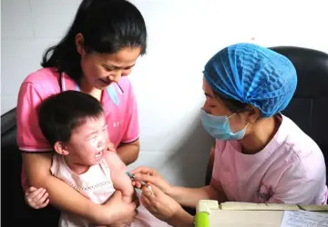  ?? — AFP photo ?? A child receiving a vaccinatio­n shot at the local disease control and prevention centre in Jiujiang in China’s central Jiangxi province.