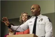  ?? THE ASSOCIATED PRESS ?? Charlotte-Mecklenbur­g Police chief Kerr Putney, right, gestures as Charlotte mayor Jennifer Roberts, left, watches in Charlotte, N.C., on Friday during a news conference.