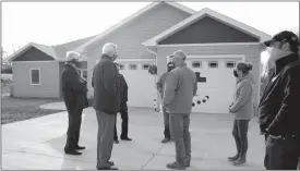  ?? Donnis Hueftle-Bullock ?? Ansley Investment Group’s new home located on North Main, that constructe­d and sold in six months along with the second home under constructi­on, was a stopping point on the Lt. Gov. tour Dec. 2. From left are Lance Bristol, Lt. Gov. Foley, Brian Beaumont, Heidi Beaumont and Chris Hogg,