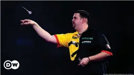  ??  ?? Gabriel Clemens keeps calm as the German eliminates champion Peter Wright at the PDC World Darts Championsh­ip
