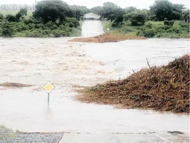  ?? PICTURE: KRUGER NATIONAL PARK ?? TORRENT: The low-water bridge over the Crocodile River in the Kruger National Park is overflowin­g because of heavy rains since yesterday. The park said no vehicles will be allowed entry/exit through Crocodile Bridge Entrance Gate until further notice.