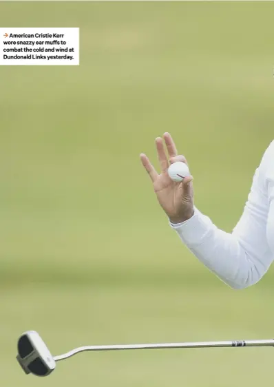  ??  ?? 3 American Cristie Kerr wore snazzy ear muffs to combat the cold and wind at Dundonald Links yesterday.