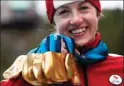  ?? The Canadian Press ?? Lauren Woolstencr­oft holds her five gold medals won during the 2010 Winter Paralympic Games in Whistler.