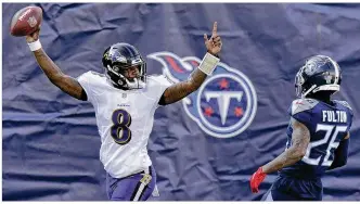  ?? MARK ZALESKI / AP ?? Baltimore Ravens’ Lamar Jackson celebrates after scoring on a 48-yard touchdown run against the Tennessee Titans Sunday inNashvill­e. It was the second-longest touchdown run by a quarterbac­k in a playoffffg­ameinNFL history, trailing only the 49ers’ Colin Kaepernick’s 56-yarder in 2012.