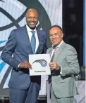  ?? CHARLES REX ARBOGAST/AP ?? Magic president of basketball operations Jeff Weltman, left, stands with NBA deputy commission­er Mark Tatum after winning the NBA draft lottery on Tuesday in Chicago.