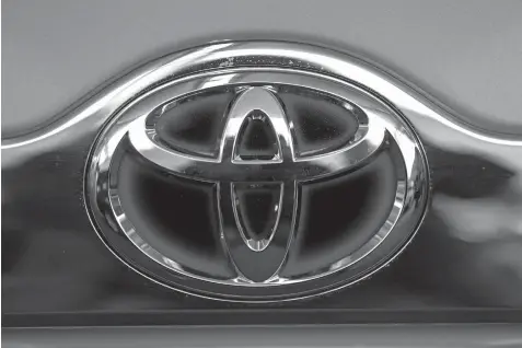  ?? ASSOCIATED PRESS ?? Photo shows the Toyota logo on the trunk of a Toyota automobile at the 2013 Pittsburgh Auto Show in Pittsburgh. Toyota executives promised by 2017 to have collision-prevention technology installed across its US line-up, in both mainstream and luxury...