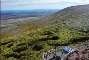  ?? ?? Drone shot of some relieved walkers at the top of Cuilcagh Moutain. Photo by Trevor Carson.