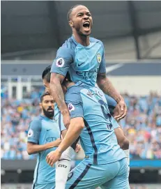  ?? AFP ?? Manchester City’s Raheem Sterling is held aloft by teammate Nolito after scoring.