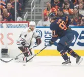  ?? AMBER BRACKEN/AP ?? Seth Jones, left, defends against the Oilers’ Connor McDavid during the third period.