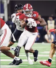  ?? Michael Ainsworth / Associated Press ?? Alabama running back Brian Robinson Jr. runs for a first down against Cincinnati during the first half of the Cotton Bowl during the College Football Playoff semifinal on Friday.