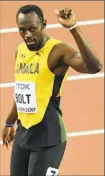  ?? Glyn Kirk/Getty Images ?? Usain Bolt wins a 100meter heat Friday at the world championsh­ips.