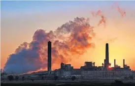  ?? [AP FILE PHOTO] ?? In this July 27 photo, the Dave Johnson coal-fired power plant is silhouette­d against the morning sun in Glenrock, Wyo.