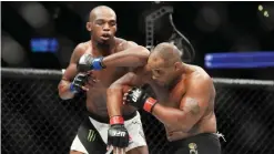  ??  ?? ANAHEIM: (L-R) Jon Jones elbows Daniel Cormier during the UFC 214 event at Honda Center on Saturday in Anaheim, California.— AFP