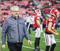  ?? JASON GETZ/AJC 2023 ?? SEC Commission­er Greg Sankey (above) and Big Ten counterpar­t Tony Petitti are the driving forces behind a proposed 14-team College Football Playoff — before even one 12-team playoff has occurred. A 14-team (or larger) playoff could happen in 2026.