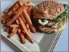  ?? BY BOB TOWNSEND CONTRIBUTE­D ?? Boxcar’s Butchers Bun features shaved rib-eye, Swiss cheese, horseradis­h aioli and fried onions, and is served here with sweet potato fries.