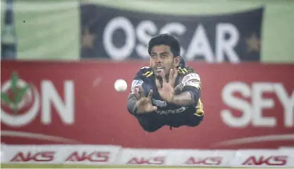  ??  ?? DHAKA: In this Dec. 9, 2016, photo, Rajshahi Kings’s Mehedi Hasan Miraz dives unsuccessf­ully to try and take a catch during the Bangladesh Premier League cricket T20 final match against Dhaka Dynamites in Dhaka, Bangladesh. — AP