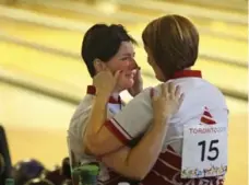  ?? RICHARD LAUTENS/TORONTO STAR ?? Robin Orlikowski, right, has a consolatio­n hug for Isabelle Rioux after the Canadian women’s doubles team finished eighth on Thursday.