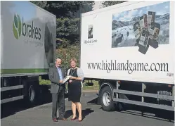  ??  ?? John McLintock of Brakes Scotland and Highland Game’s Ingela Nissen seal the new supply deal.