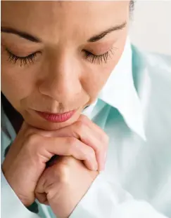  ??  ?? Woman with Head Bowed --- Image by ? Royalty-Free/Corbis