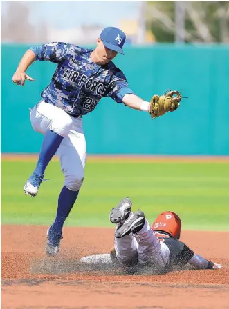  ?? ADOLPHE PIERRE-LOUIS/JOURNAL ?? Air Force Academy shortstop Tyler Zabojnik is unable to get down to make a tag on UNM’s Robby Campillo, as Campillo dives into second base Sunday at Santa Ana Star Field.