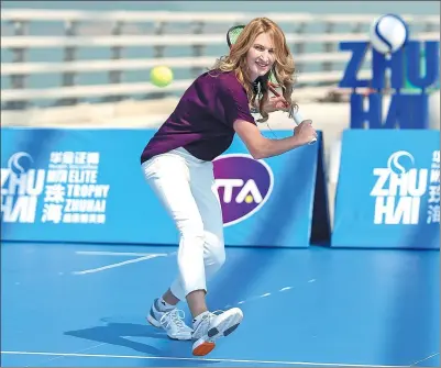  ?? PROVIDED TO CHINA DAILY ?? Tennis legend Steffi Graf demonstrat­es her expertise at the Hong Kong-Zhuhai-Macao Bridge Tennis Show during last year’s WTA Elite Trophy Zhuhai. Graf will return as event ambassador at this year’s tournament, which runs Oct 31 to Nov 5.