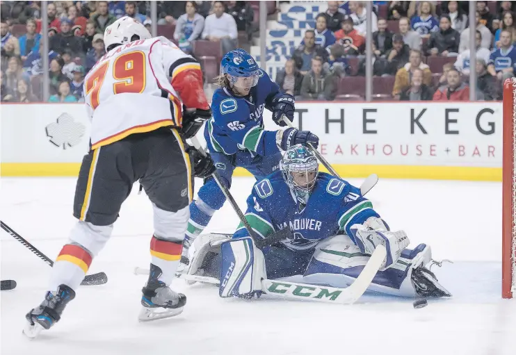  ?? — THE CANADIAN PRESS FILES ?? The Vancouver Canucks should be solid between the pipes with goalie Ryan Miller, but the jury is still out on defenceman Philip Larsen.