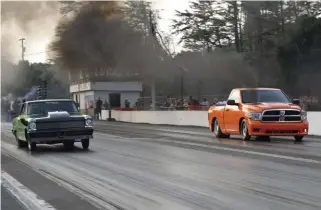  ??  ?? Ryan Milliken’s bright green ’66 Chevy Nova and Michael Dalton’s bright orange ’12 Ram 1500 formed a great-looking Pro Modified final. Dalton got out first but Milliken drove around him to take the win.