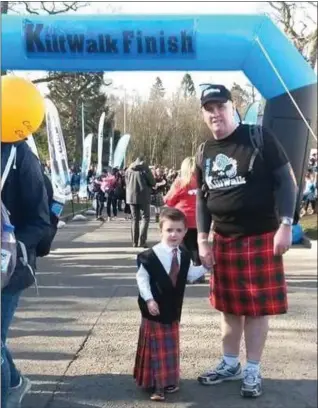  ??  ?? Craig and Logan in their kilts for a Kiltwalk event