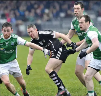  ??  ?? Adrian Marren of Sligo is surrounded by Fermanagh defenders. Pic: Tom Callanan.