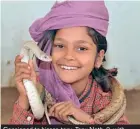  ??  ?? Consigned to hissss-tory: Tanu Nath, 9, with snakes hanging around her neck - but the snake charming industry is fighting for survival due to stringent wildlife protection laws