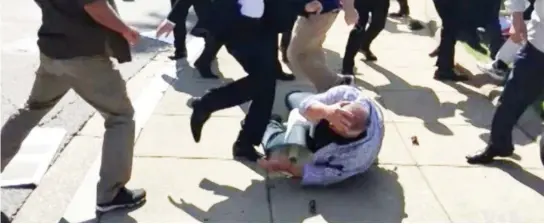  ??  ?? In this file video screenshot provided by Voice of America, members of Turkish President Recep Tayyip Erdogan's security detail are shown violently reacting to peaceful protesters during Erdogan's trip last month to Washington. (AP)