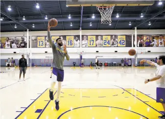  ?? Michael Macor / The Chronicle ?? JaVale McGee works on his shots during practice Friday in Oakland. McGee, like the rest of the team, got a day off after the regular season ended to reset his mind before the playoffs.