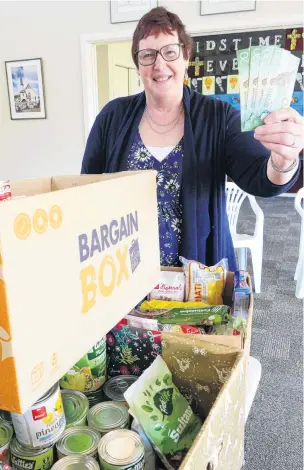  ?? PHOTO: RICHARD DAVISON ?? Cash bonus . . . LawrenceTu­apeka Combined Church Foodbank joint coordinato­r Stephanie Swann says the organisati­on can now also help community members in financial need.