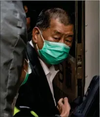  ?? ANTHONY KWAN — GETTY IMAGES ?? Jimmy Lai, media tycoon and the Apple Daily founder, boards a Correction­al Services Department vehicle as he leaves the Court of Final Appeal following a bail hearing on February 1, 2021 in Hong Kong, China.
