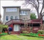  ??  ?? Two decks overlook the back garden; the home’s basement level opens to the lower deck.