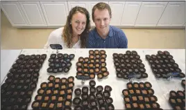  ?? STAFF PHOTOS BY DARWIN WEIGEL ?? Terra and Chris Neely opened Heritage Chocolates on the square in Leonardtow­n a little over a year ago. The shop also sells handmade gelato.