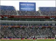  ?? THANASSIS STAVRAKIS — THE ASSOCIATED PRESS FILE ?? A giant screen reports an incident is being investigat­ed by VAR (Video Assistant Referee) during the Confederat­ions Cup, Group B soccer match between Germany and Cameroon, at the Fisht Stadium in Sochi, Russia.