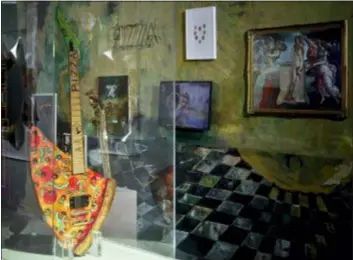  ?? BEBETO MATTHEWS — THE ASSOCIATED PRESS ?? This photo shows the “Pizza Guitar,” from musician Andrew W.K., part of a group art exhibition celebratin­g pizza at The Museum of Pizza in New York.