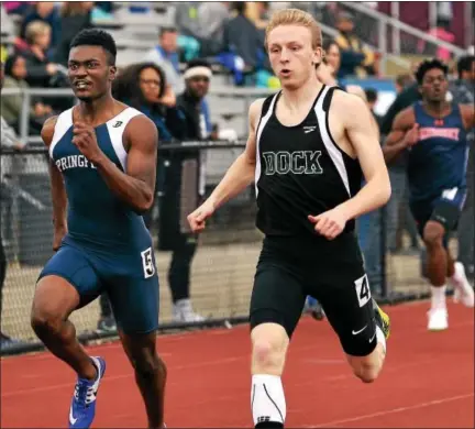  ?? BOB RAINES — DIGITAL FIRST MEDIA ?? Christophe­r Dock’s Austin Kratz edges Springfiel­d (Montco)’s Eric Westray in the 200-meter run Saturday.