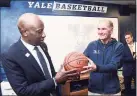  ?? Arnold Gold / Hearst Connecticu­t Media ?? David Swenson, center, with Yale men’s basketball coach James Jones, left, in 2019.