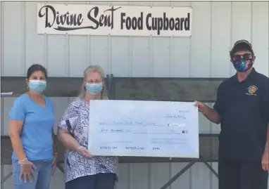  ?? SIBMITTED PHOTO ?? The Rotary Club of Oxford recently presented a check for $1,000to the Divine Sent Food Cupboard, Oxford. From left are co-executive director Sylvia Justin; executive director Donna Lee Moore and Oxford Rotary President Dr. Ray Fischer.